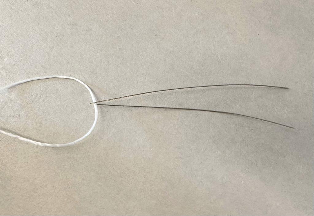 cavetto agganciato a filo elastico